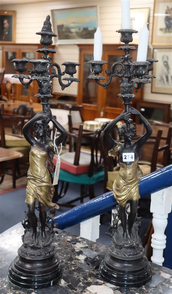 A pair of figural candelabra height 69cm